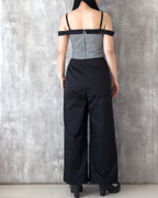 Model wearing the Amy Jumpsuit, polka dot and gingham check with off-shoulder collar. Back view — Atë