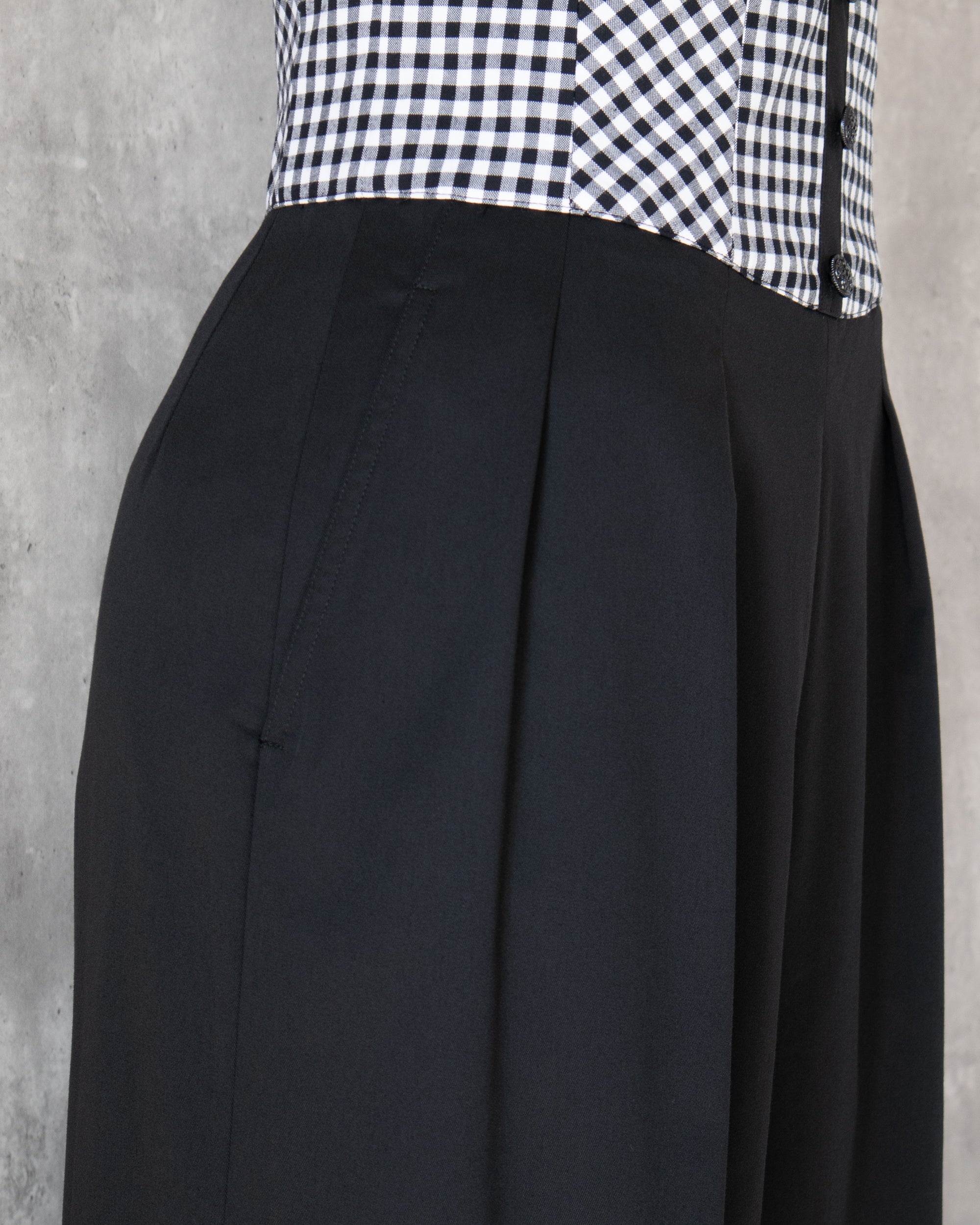 Amy Jumpsuit side view, details of tuck and pocket. 