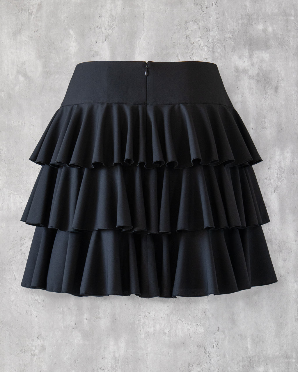Amy Ruffle Skirt in black — back view, concealed zipper closure