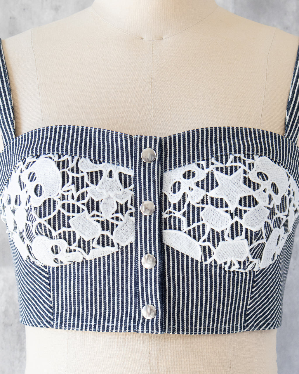 Carla Bustier detail — skull-motif lace overlay
