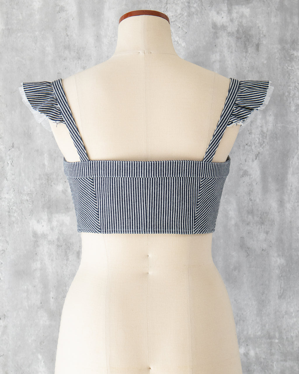 Carla Bustier in indigo hickory denim — back view