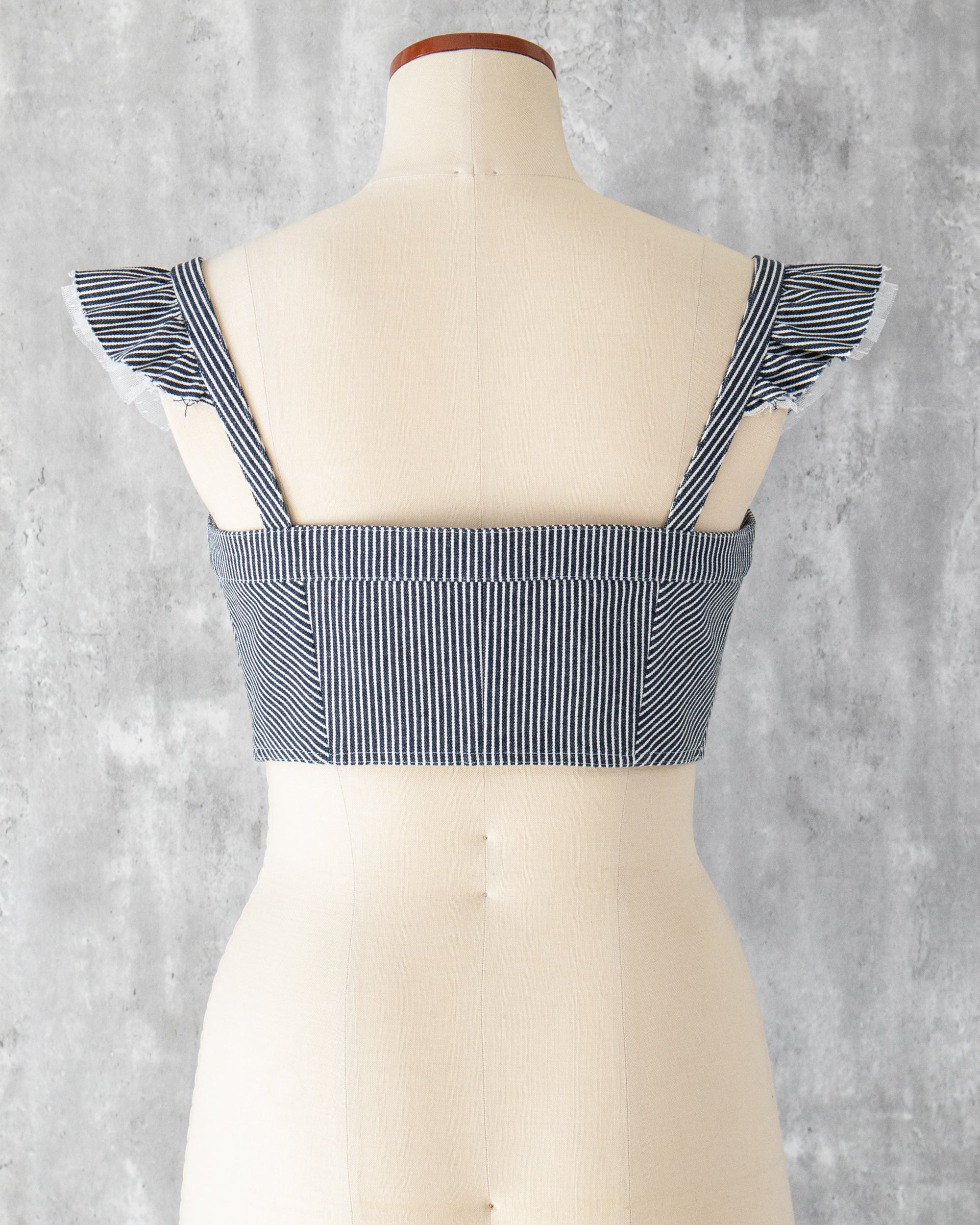 Carla Bustier in indigo hickory denim — back view