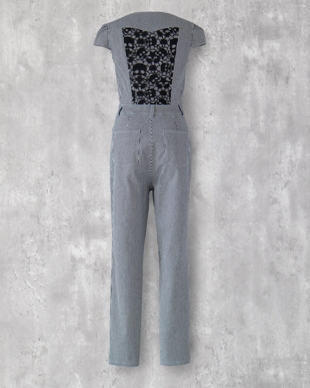 Carla Jumpsuit in indigo hickory denim — back view, black skull-motif lace