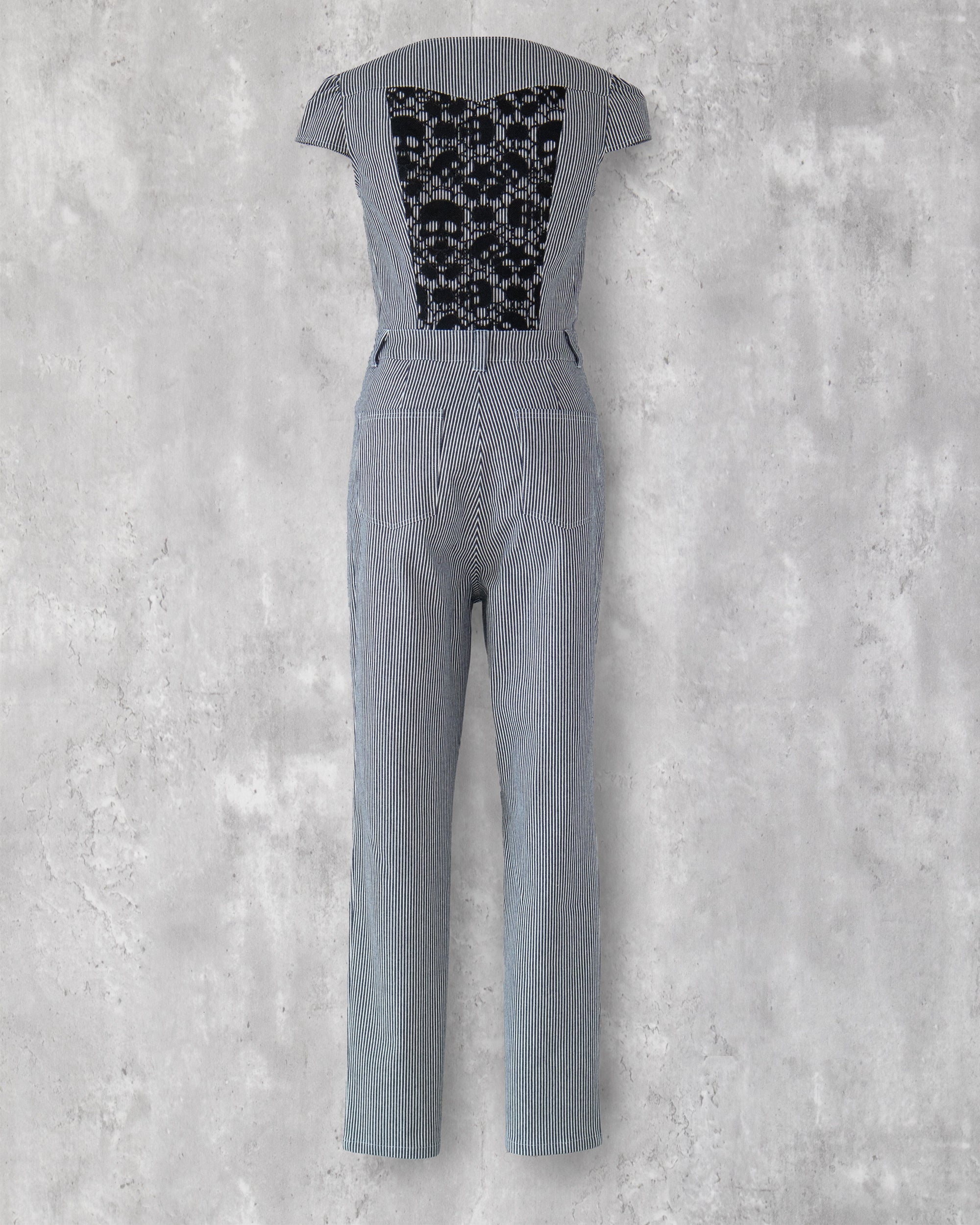 Carla Jumpsuit in indigo hickory denim — back view, black skull-motif lace