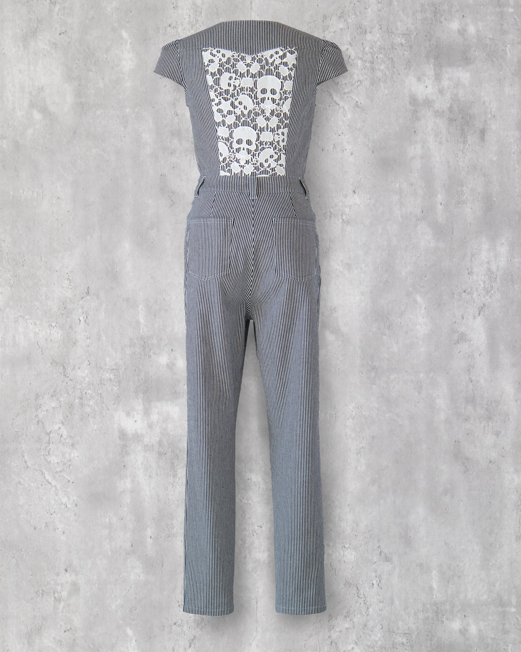 Carla Jumpsuit in indigo hickory denim — back view, white skull-motif lace