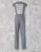Carla Jumpsuit in indigo hickory denim — back view, white skull-motif lace