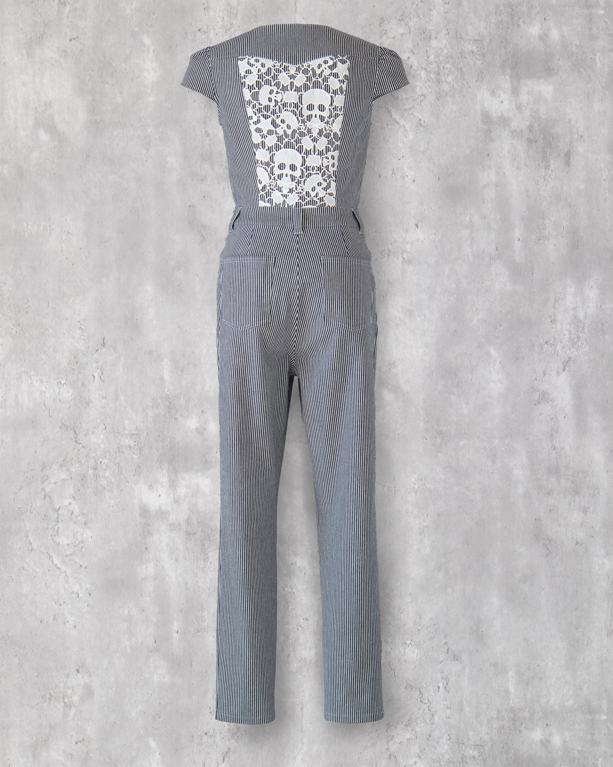 Carla Jumpsuit in indigo hickory denim — back view, white skull-motif lace