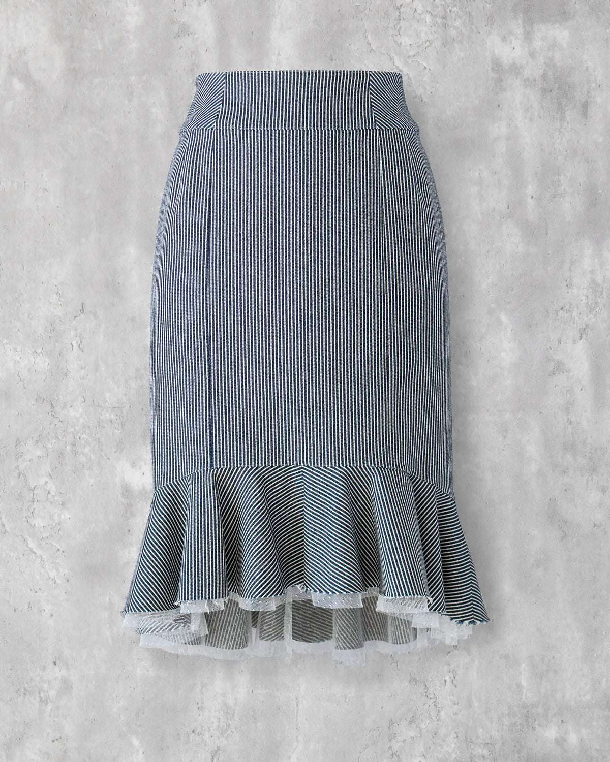 High-waisted denim skirt in indigo hickory stripe with frill hem — Carla Skirt by Atë, front view