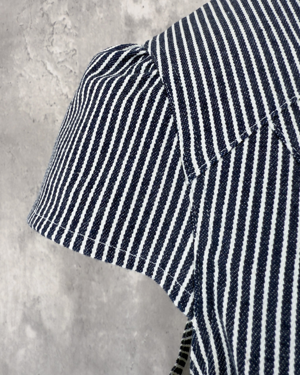 Carla Jumpsuit in indigo hickory denim — detail of french sleeve