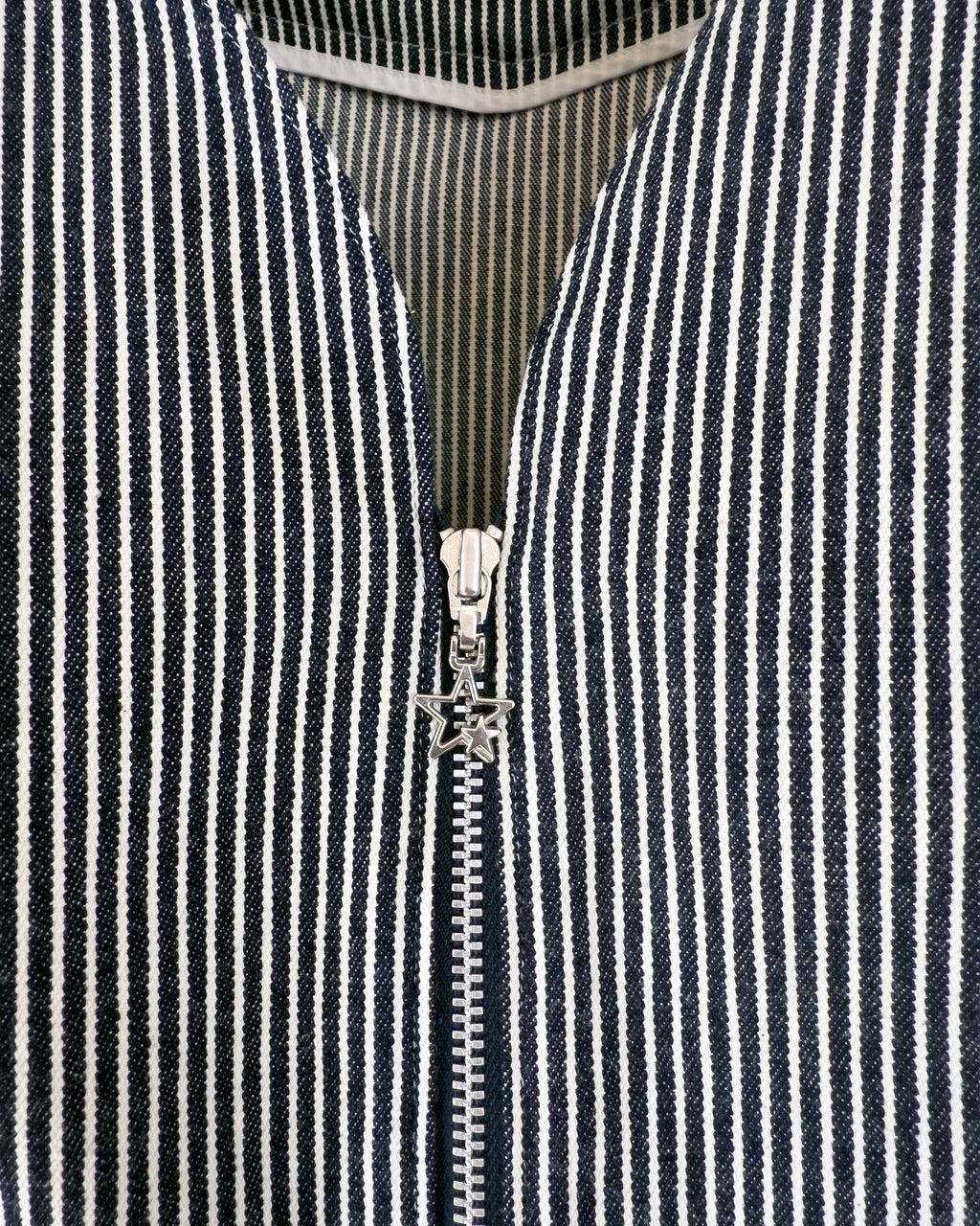 Carla Jumpsuit in indigo hickory denim — detail of zipper with star charm