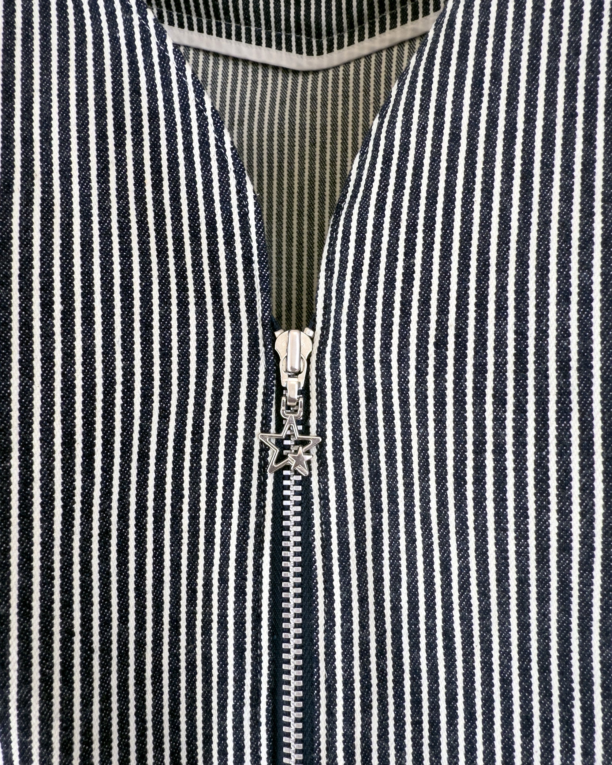 Carla Jumpsuit in indigo hickory denim — detail of zipper with star charm