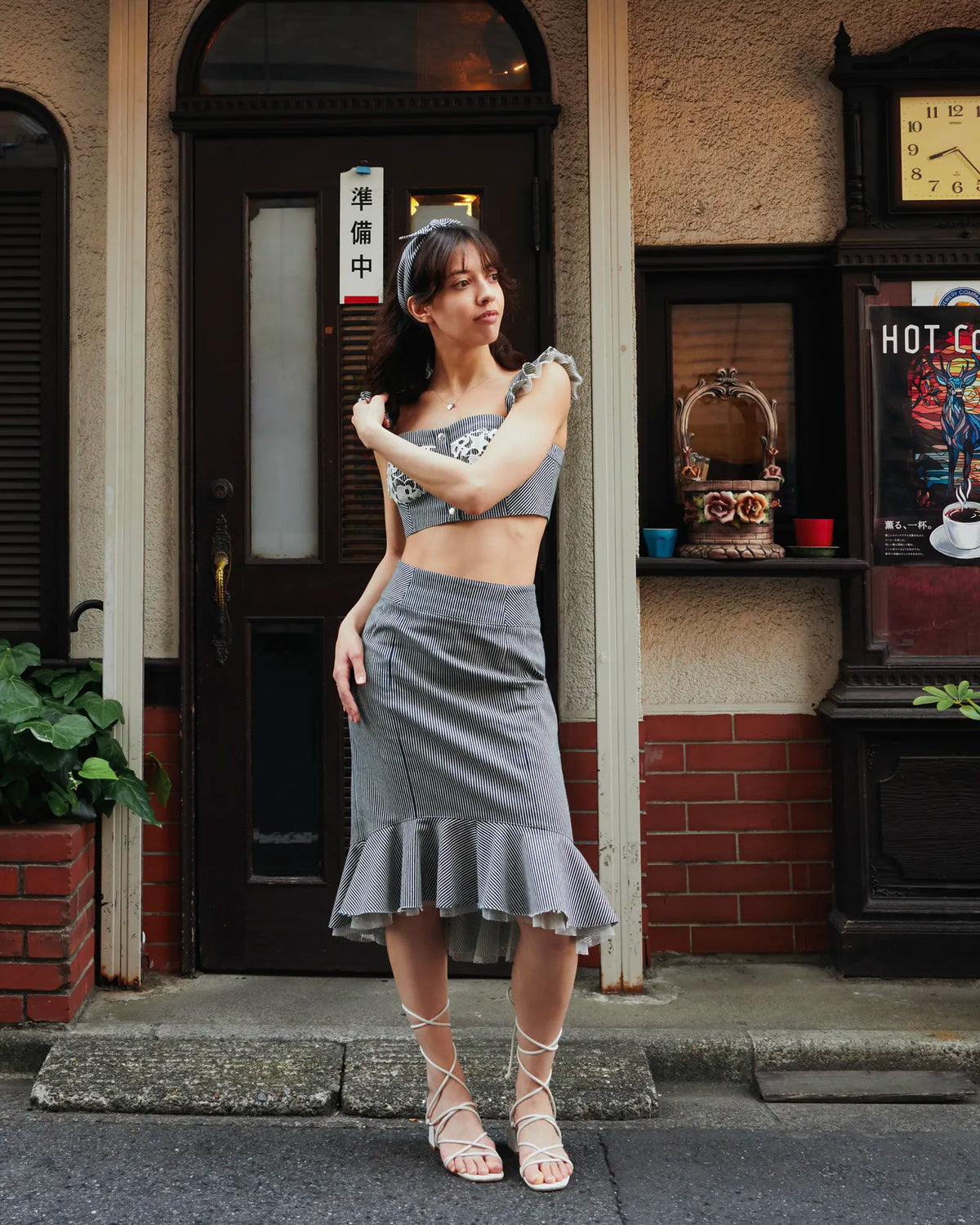 Model wearing the coordinated Carla hickory denim set, street setting — Carla by Atë